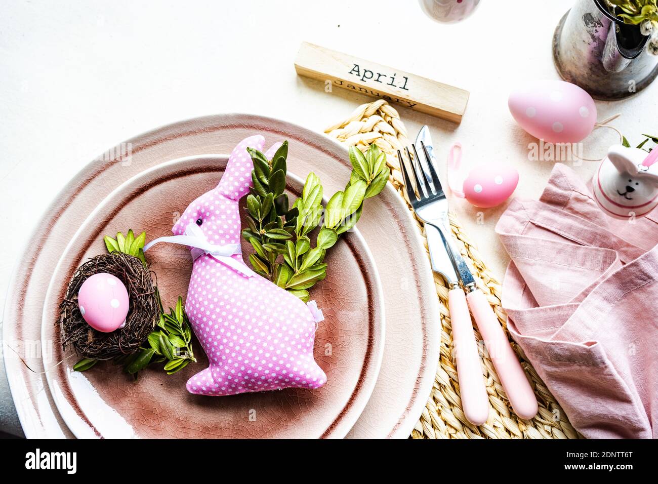 Easter place setting with an Easter bunny decoration on a table Stock Photo