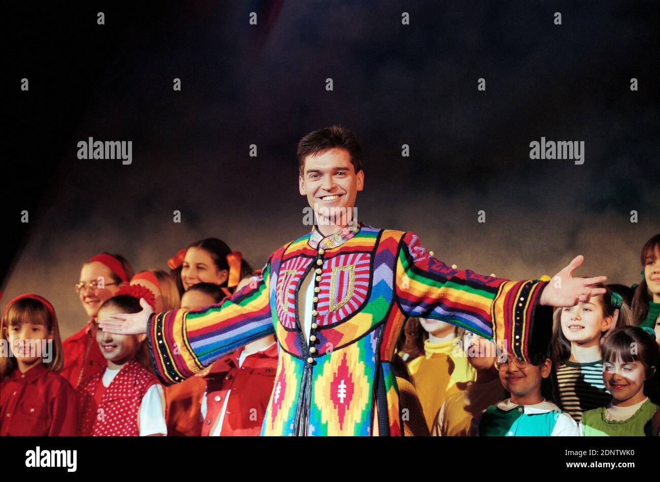 Phillip Schofield (as Joseph) in JOSEPH AND THE AMAZING TECHNICOLOR DREAMCOAT music by Andrew Lloyd Webber lyrics by Tim Rice at Labatt's Apollo Hammersmith London in 1996. Directed by Steven Pimlott with designs by Mark Thompson, lighting by Andrew Bridge, choreography by Anthony van Laast Stock Photo