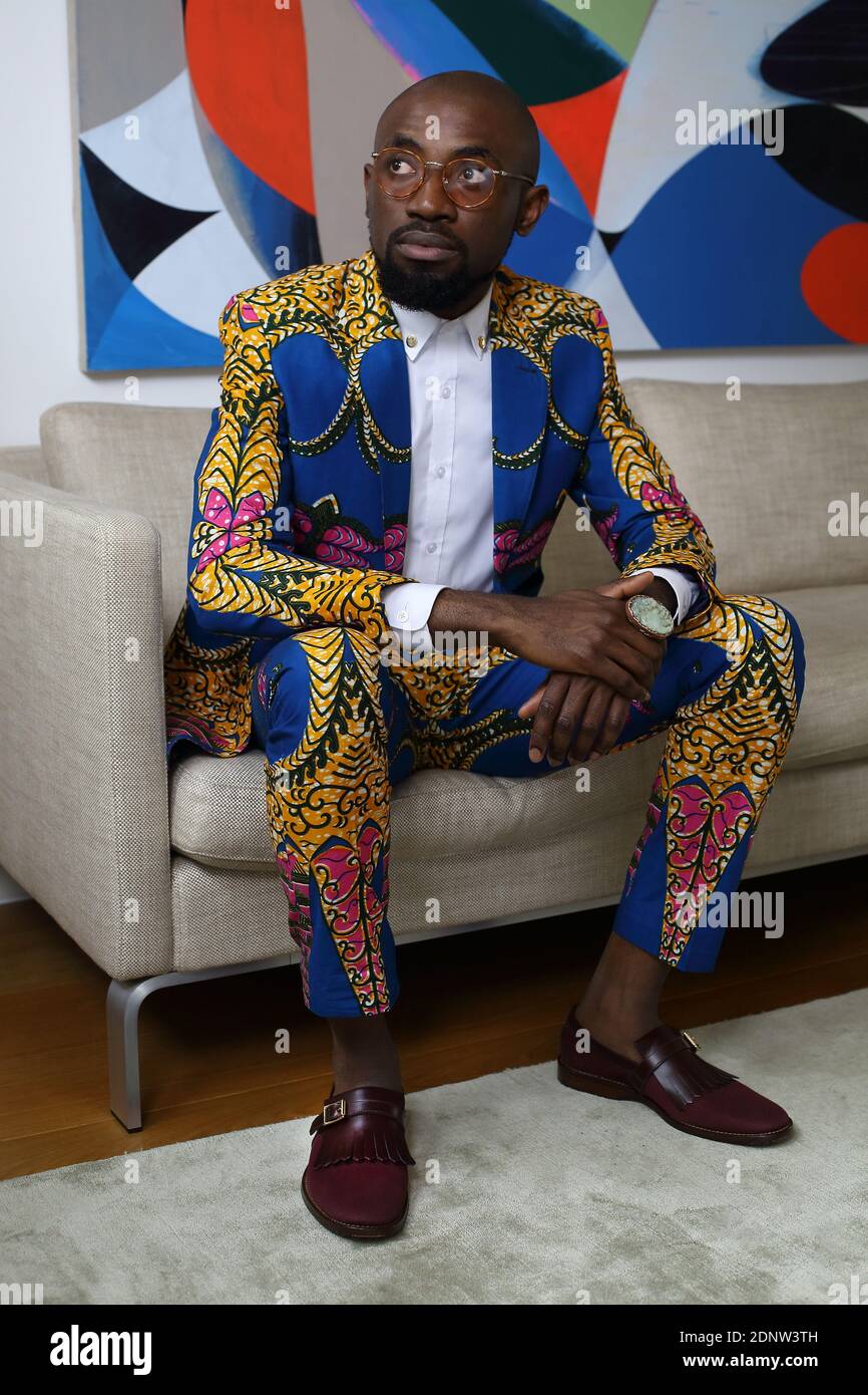 African man sitting in suit hi-res stock photography and images - Alamy