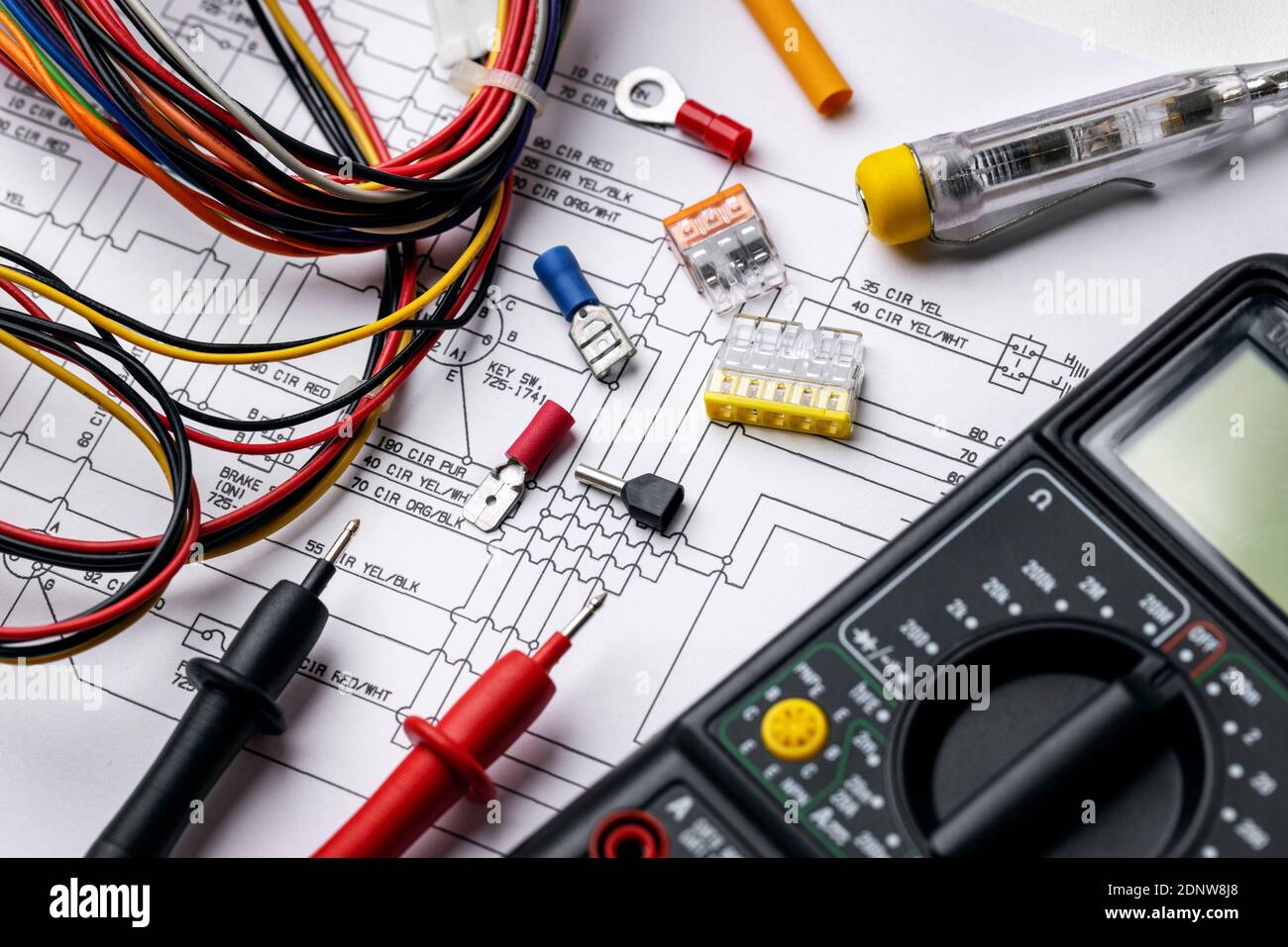 electrician tools and electrical equipment on wiring diagram Stock Photo
