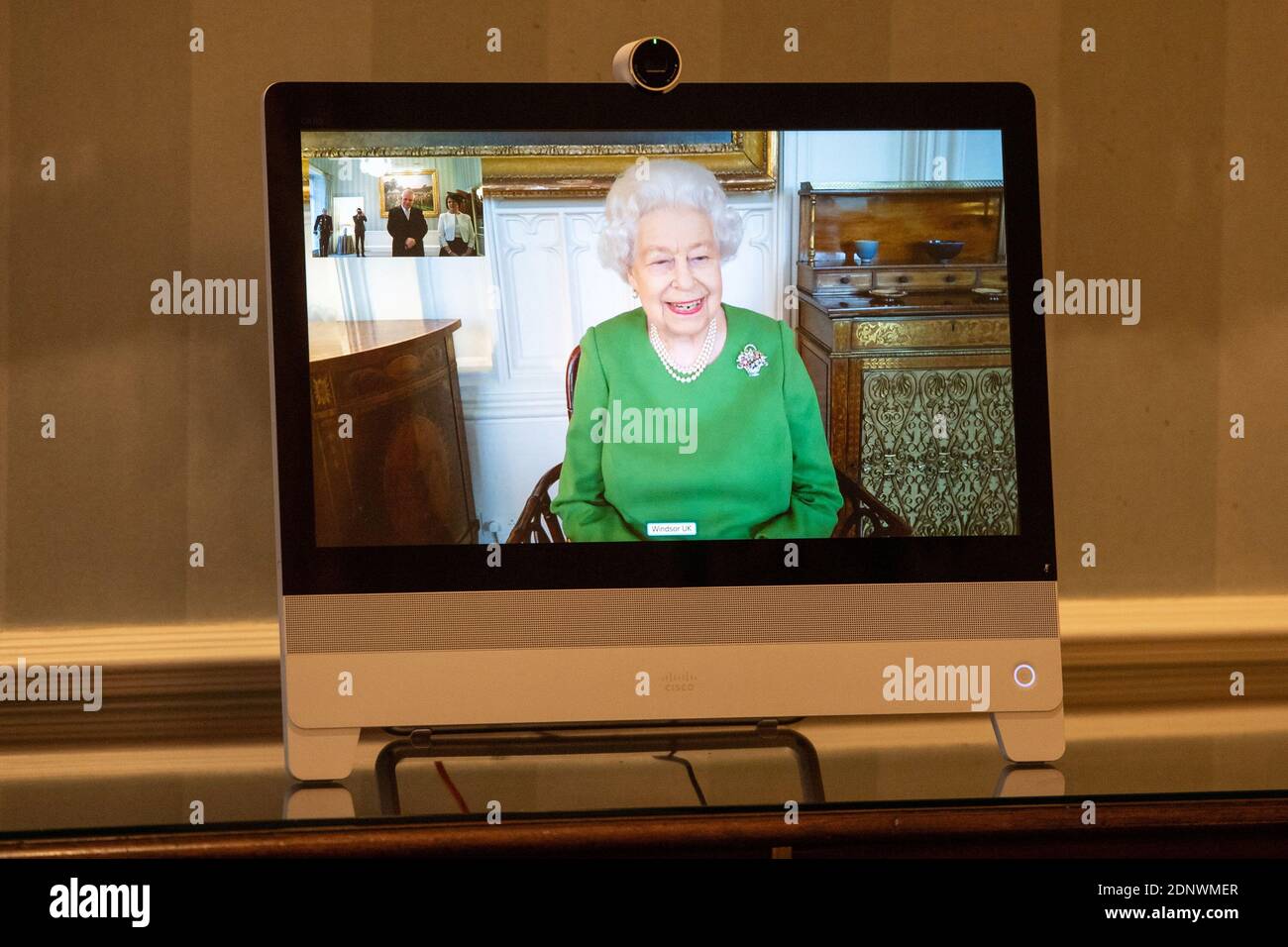 Britain's Queen Elizabeth appears on a screen by videolink from Windsor Castle, where she is in residence, during a virtual audience to receive Ambassador of Belgium Bruno van der Pluijm and Hildegarde Van de Voorde who attended at Buckingham Palace in London, Britain December 18, 2020. Dominic Lipinski/PA Wire/Pool via REUTERS Stock Photo