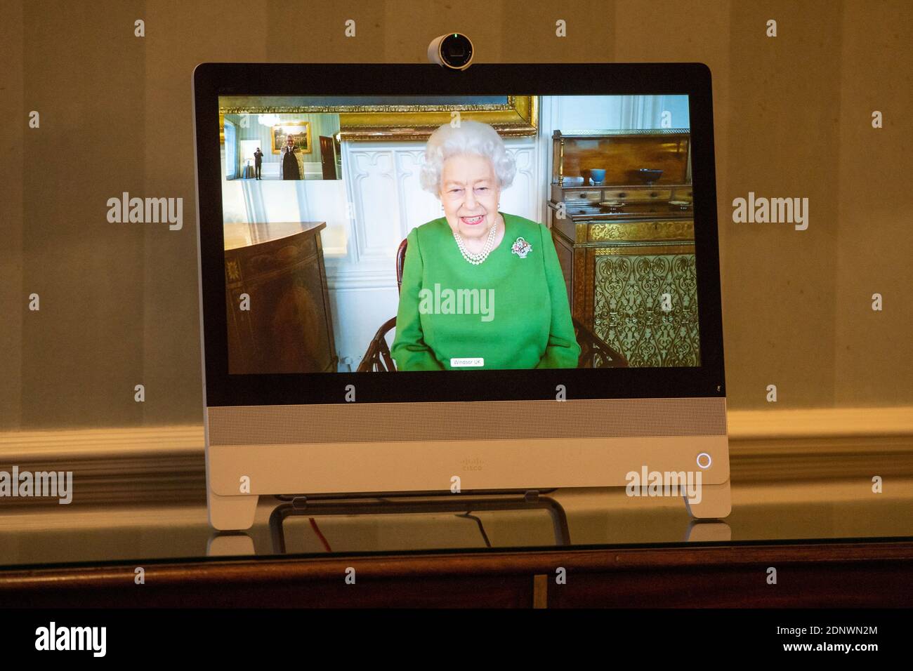 Britain's Queen Elizabeth appears on a screen by videolink from Windsor Castle, where she is in residence, during a virtual audience to receive Ambassador of Belgium Bruno van der Pluijm and Hildegarde Van de Voorde who attended at Buckingham Palace in London, Britain December 18, 2020. Dominic Lipinski/PA Wire/Pool via REUTERS Stock Photo