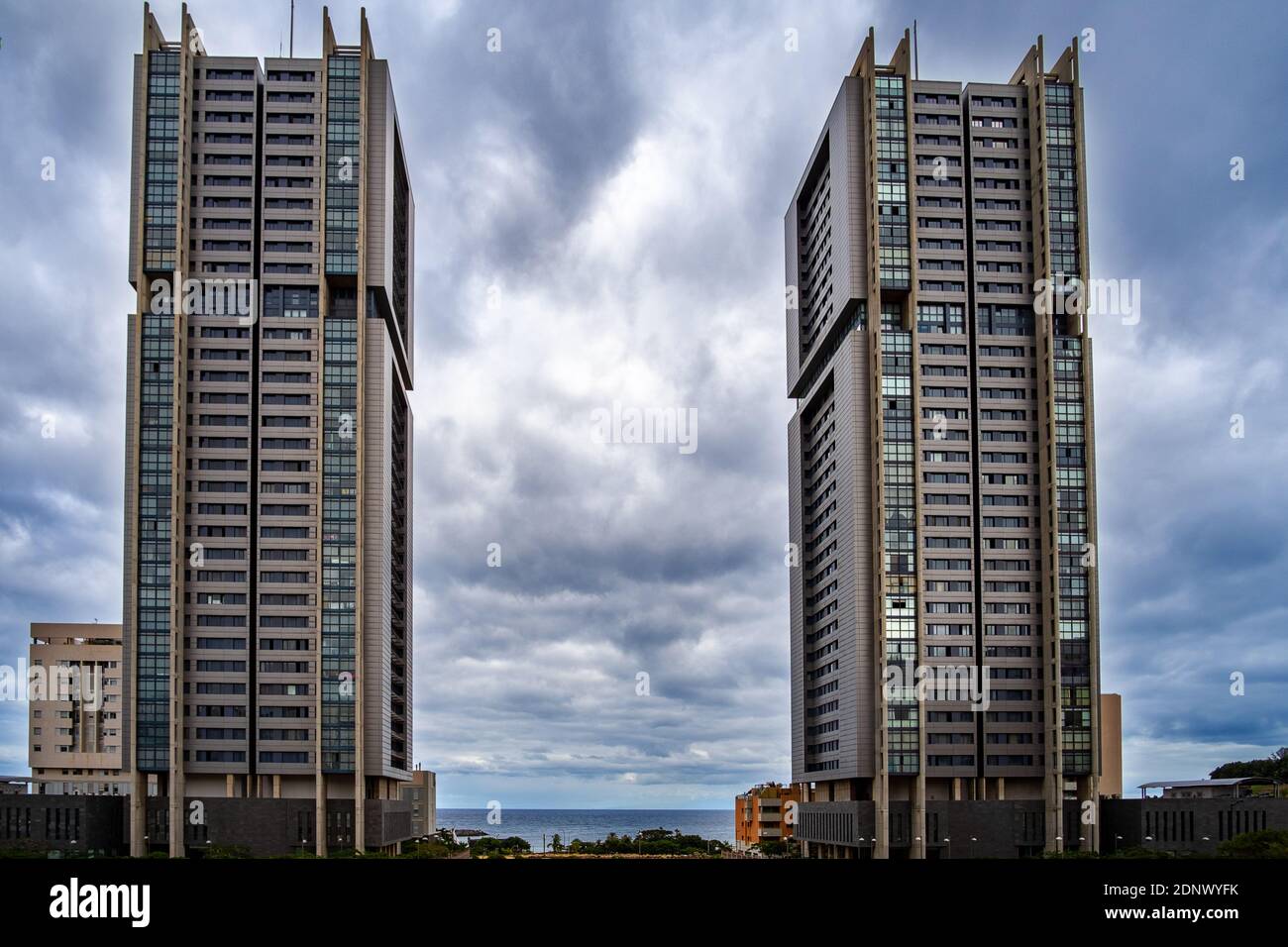 Low Angle View Of Buildings Against Cloudy Sky Stock Photo