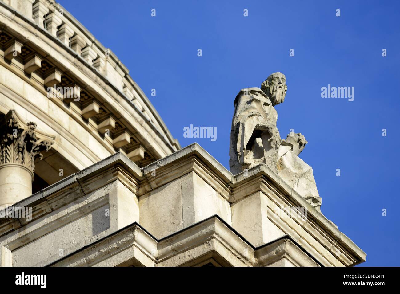 London, England, UK. St Paul's Cathedral. Statue of St. Simon the Zealot / Simon Zelote sitting, with a saw on the south facade Stock Photo