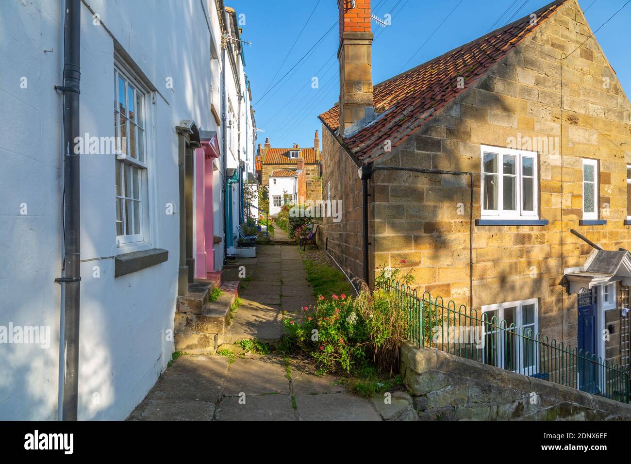 View Of White Washed Houses And Cobbled Street In Robin Hood s Bay view-of-white-washed-houses-and-cobbled-street-in-robin-hood-s-bay