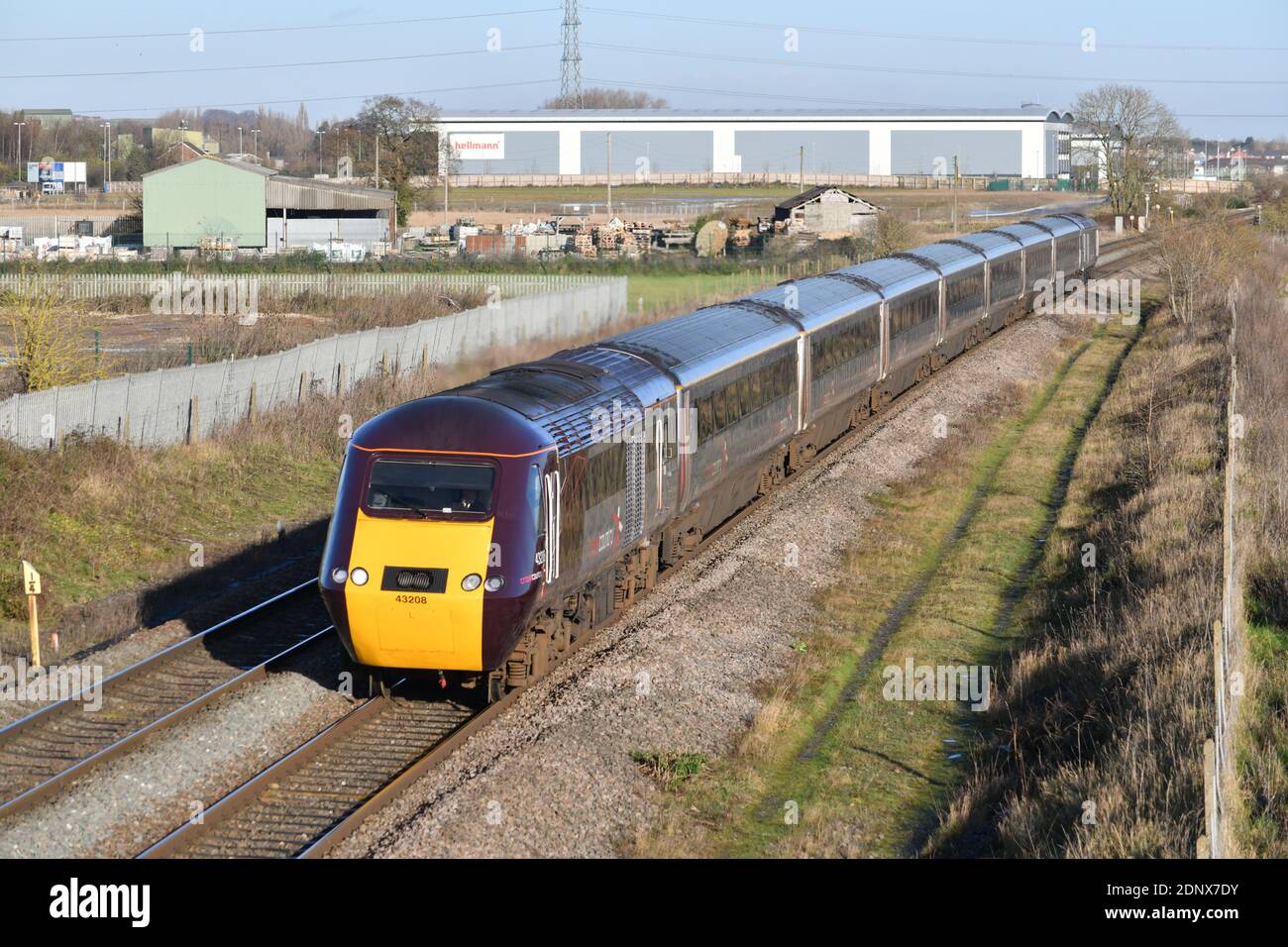 Ex-works Power Car 43208 leads a CrossCountry HST on the 08:08 Edinburgh to Bristol Temple Meads passing Barton Under Needwood on 17 December 2020 Stock Photo