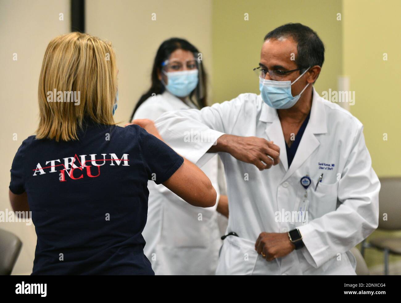 FORT LAUDERDALE, FLORIDA DECEMBER 17 Lucy Corso, RN, Intensive Care Unit elbow bump Dr. Sunil