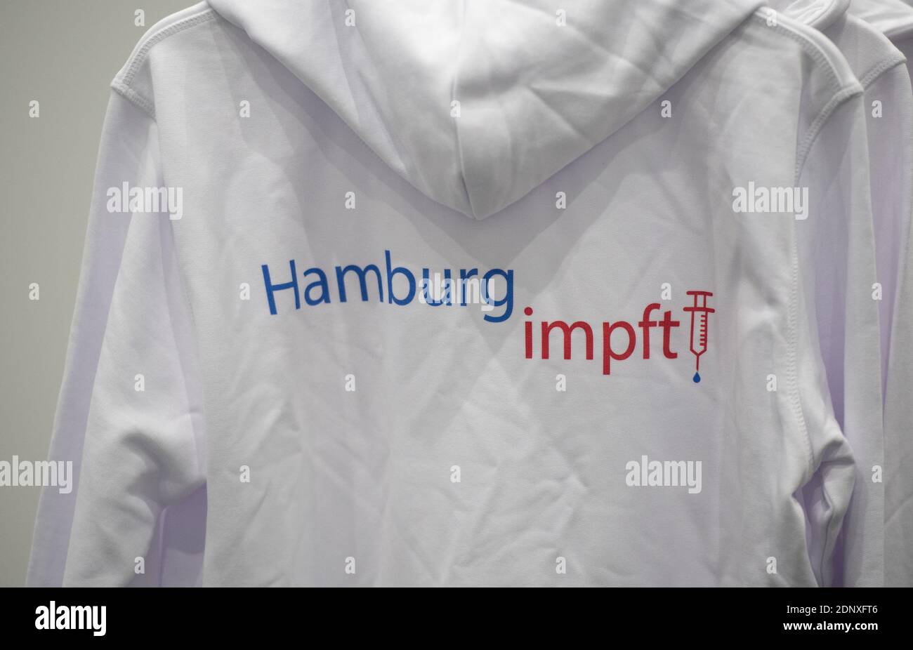 Hamburg, Germany. 18th Dec, 2020. A hoodie with the inscription 'Hamburg impft' hangs in the new vaccination centre in the exhibition halls. Credit: Daniel Reinhardt/dpa/Alamy Live News Stock Photo