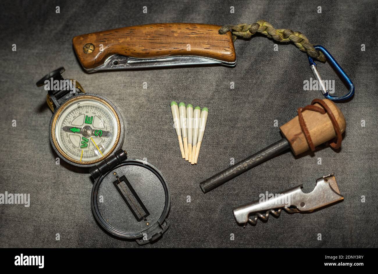 EDC. Wearable survival kit. Folding knife, compass and hunting matches with  flint. Tools for overnight in the forest. Tools for the expedition Stock  Photo - Alamy