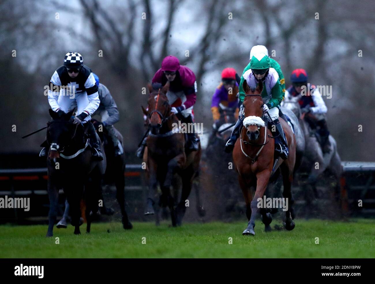 Runners and riders compete in the Sky Sports Racing HD Virgin 535 Novices' Handicap Hurdle at Uttoxeter Racecourse. Stock Photo