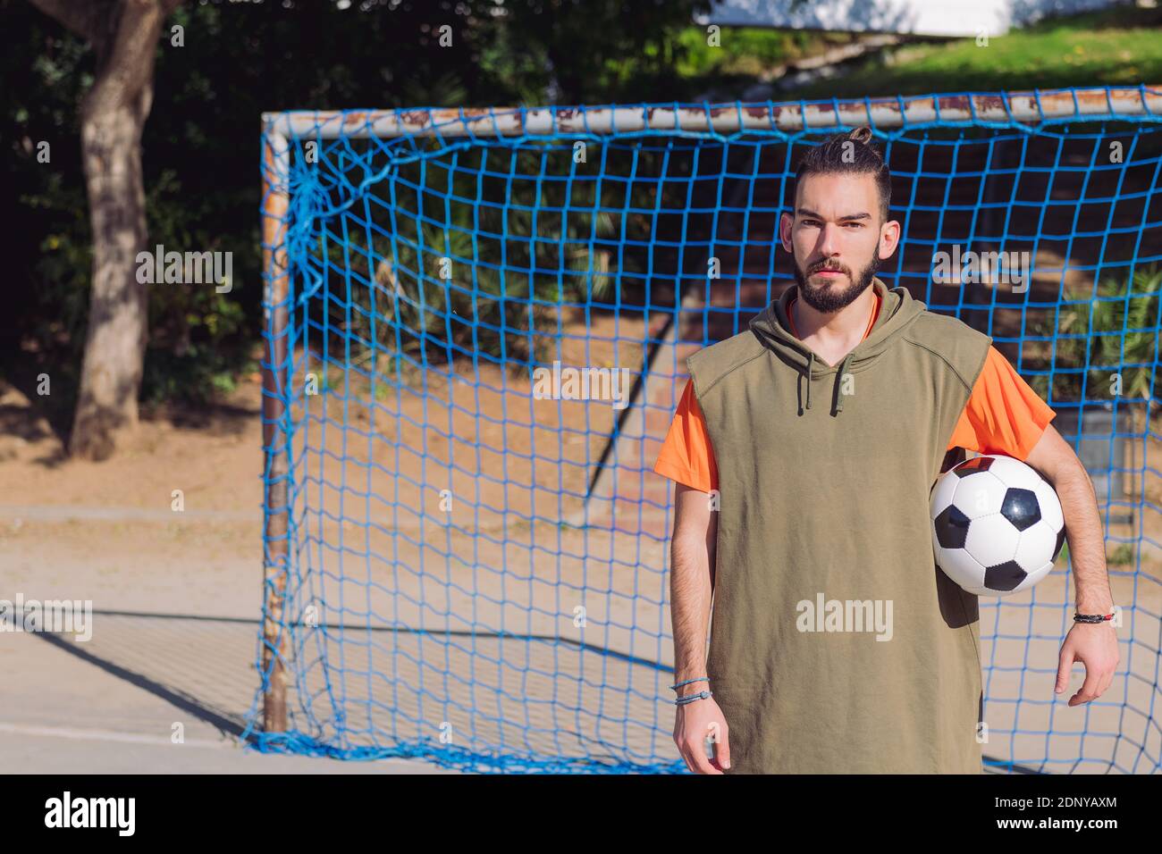 Handsome Hipster Soccer Player In Front Of The Goal Of An Urban Court With The Ball Under His Arm Concept Of Healthy Lifestyle And Urban Sport In The Stock Photo Alamy Handsome Hipster Soccer Player In Front Of The Goal Of An Urban Court With The Ball Under His Arm Concept Of Healthy Lifestyle And Urban Sport In The Stock Photo Alamy