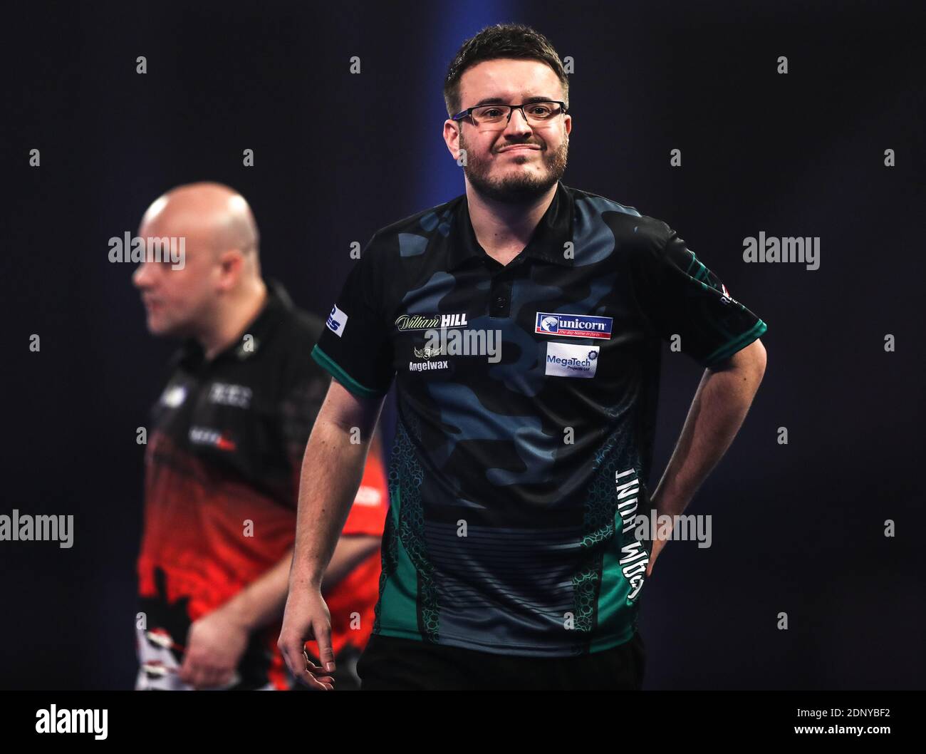 Adam Hunt walks off stage after winning a set against Jamie Hughes during  day four of the William Hill World Darts Championship at Alexandra Palace,  London Stock Photo - Alamy