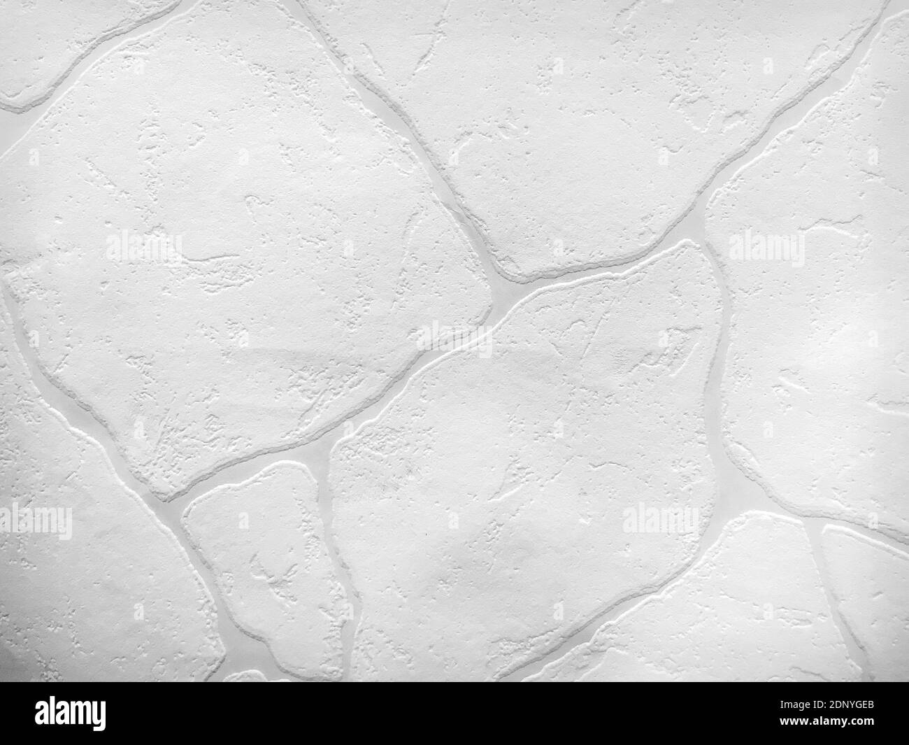 White stone wall surface texture as background. Closeup Stock Photo