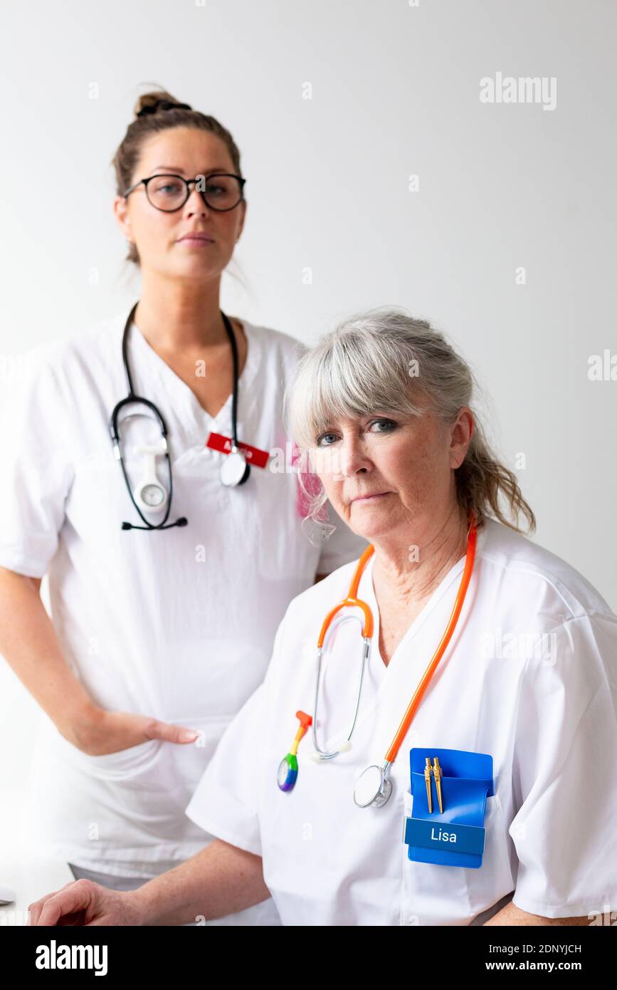 Two female doctors looking at camera Stock Photo