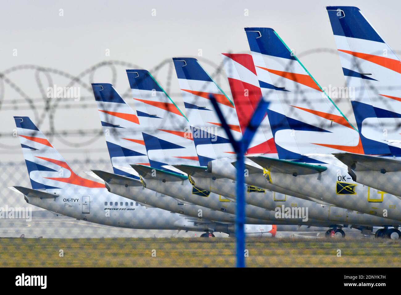 grounded planes behind the barbed wire during Covid-19 pandemy Stock Photo
