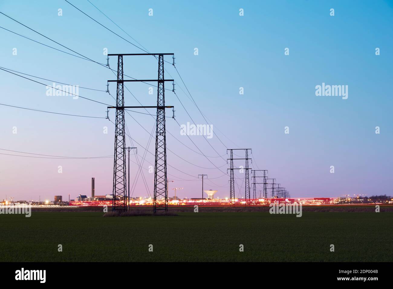 Silhouette of electricity pylon at sunset Stock Photo - Alamy