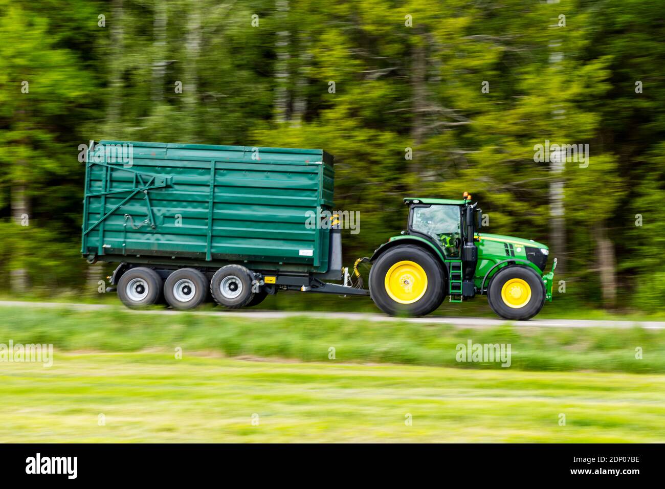 Tractor with trailer on move Stock Photo