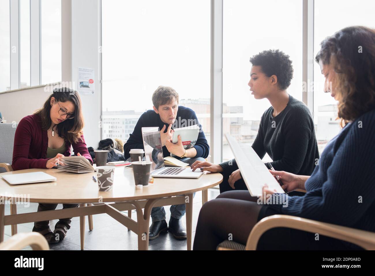 People sitting in library Stock Photo - Alamy