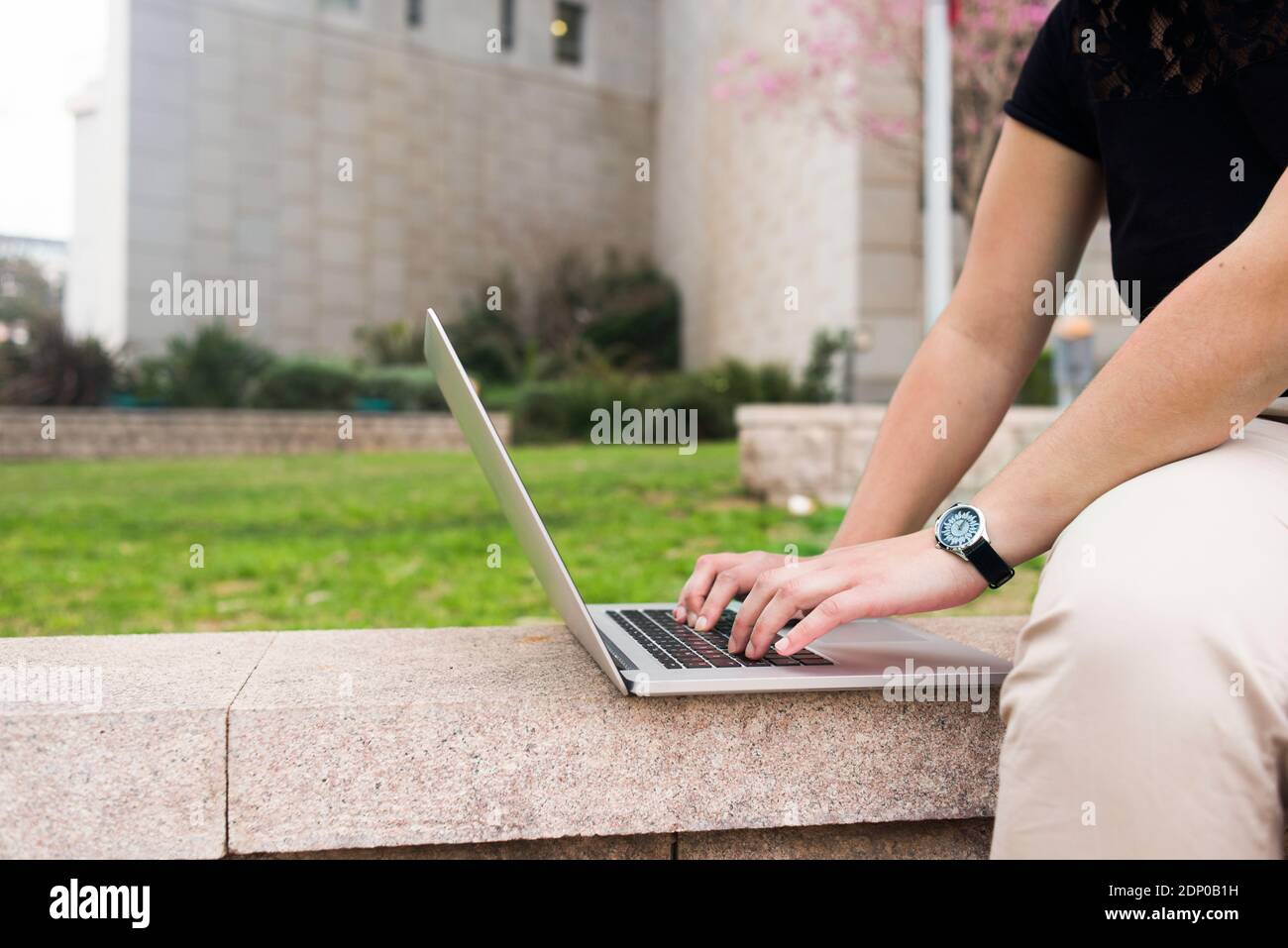 Womans hands using laptop Stock Photo