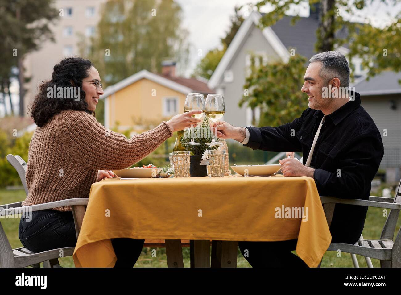Couple having meal in garden Stock Photo