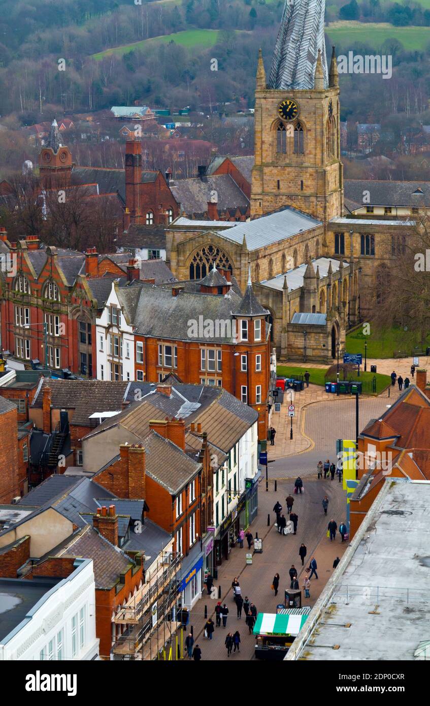 View of the crooked spire church and Burlington Street a pedestrianised shopping street in Chesterfield town centre in Derbyshire England UK Stock Photo