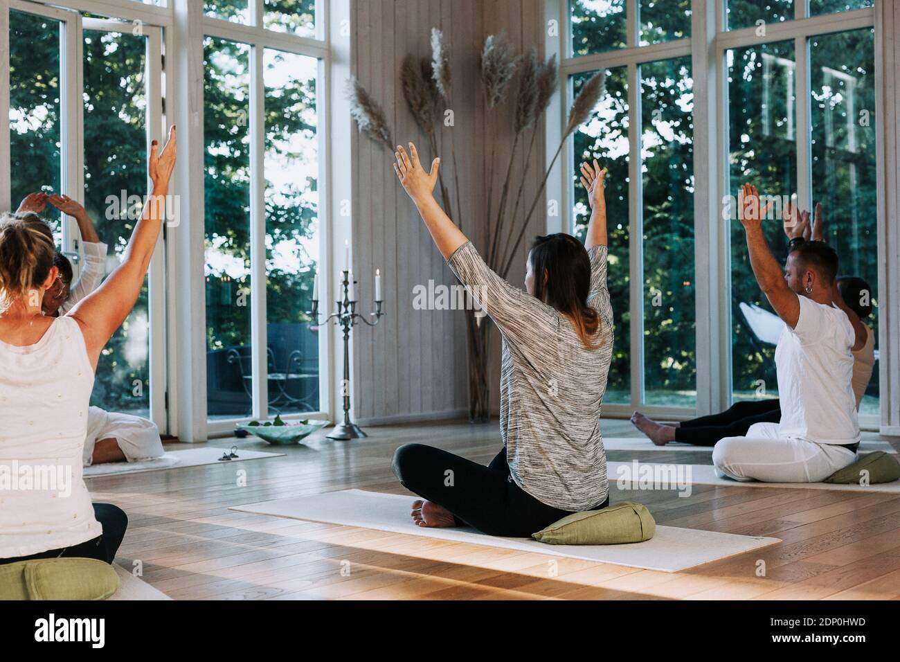 People practicing yoga in class Stock Photo