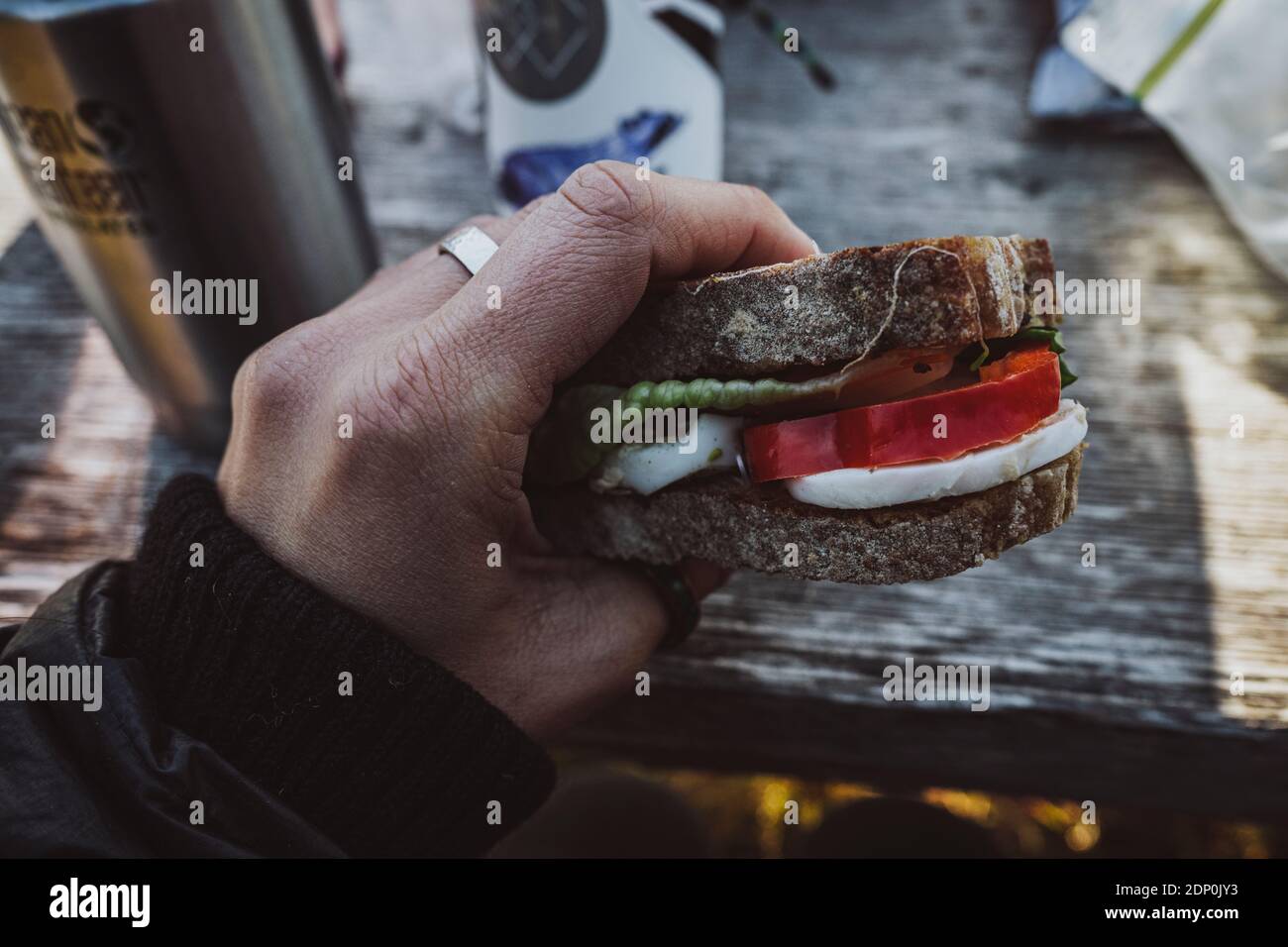 Hand holding sandwich Stock Photo Alamy