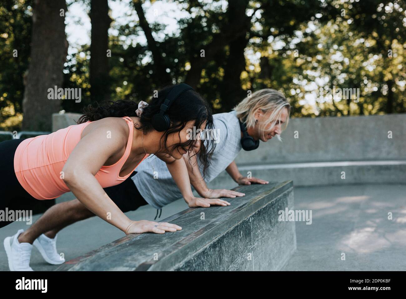 Couple doing push-ups together Stock Photo