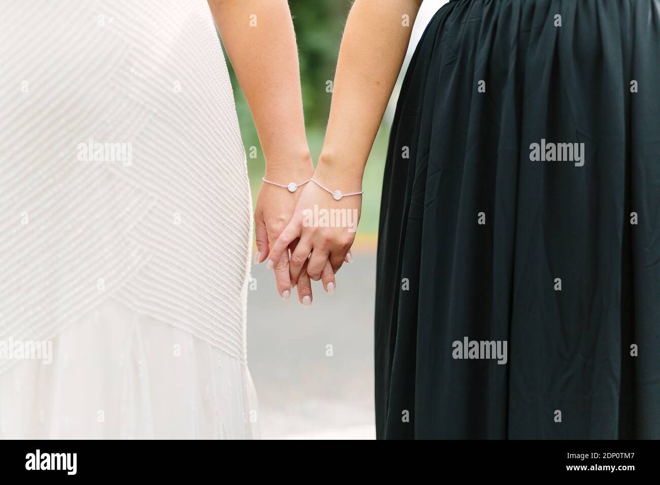 Brides holding hands Stock Photo