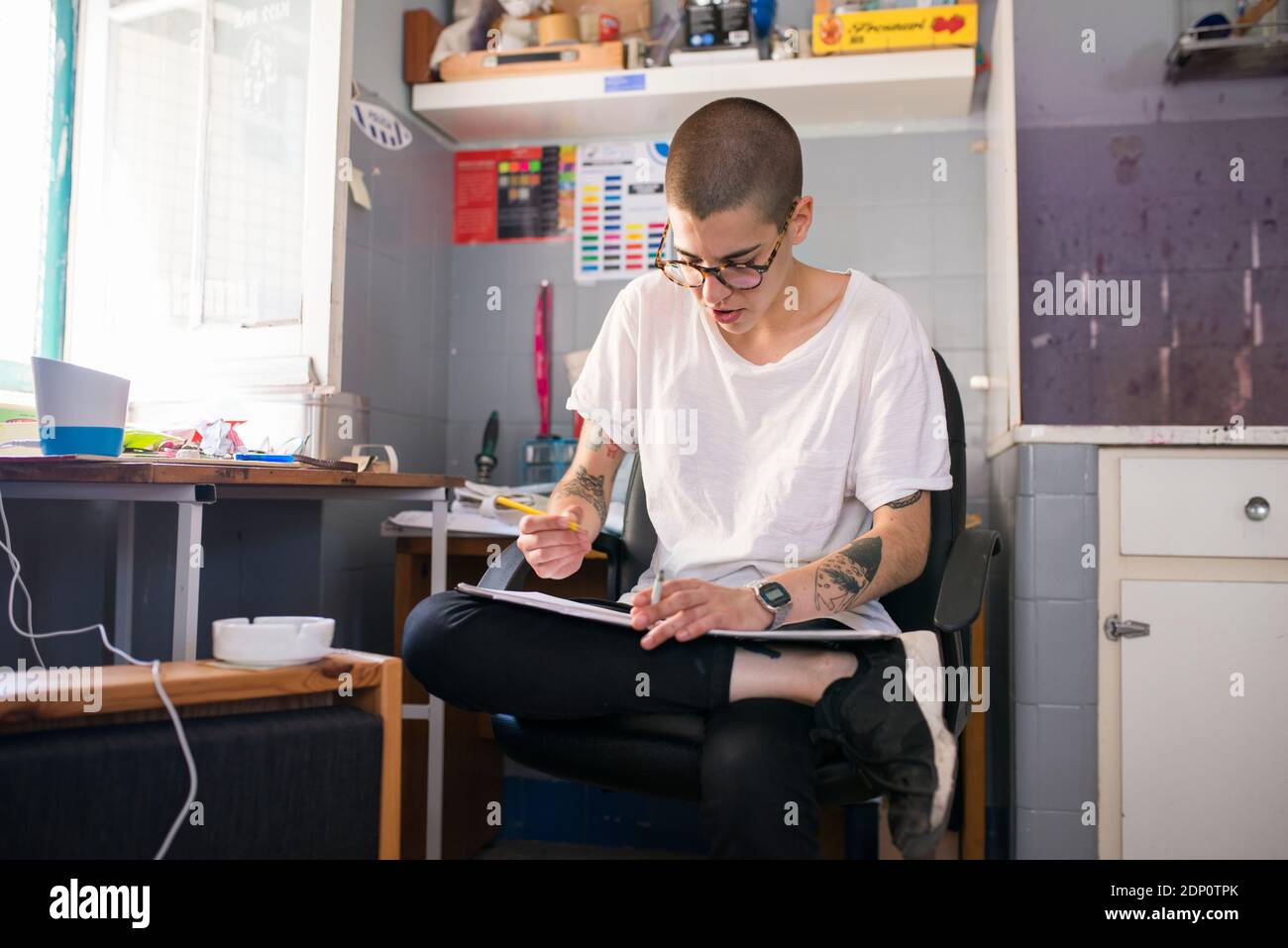 Female designer working in office Stock Photo