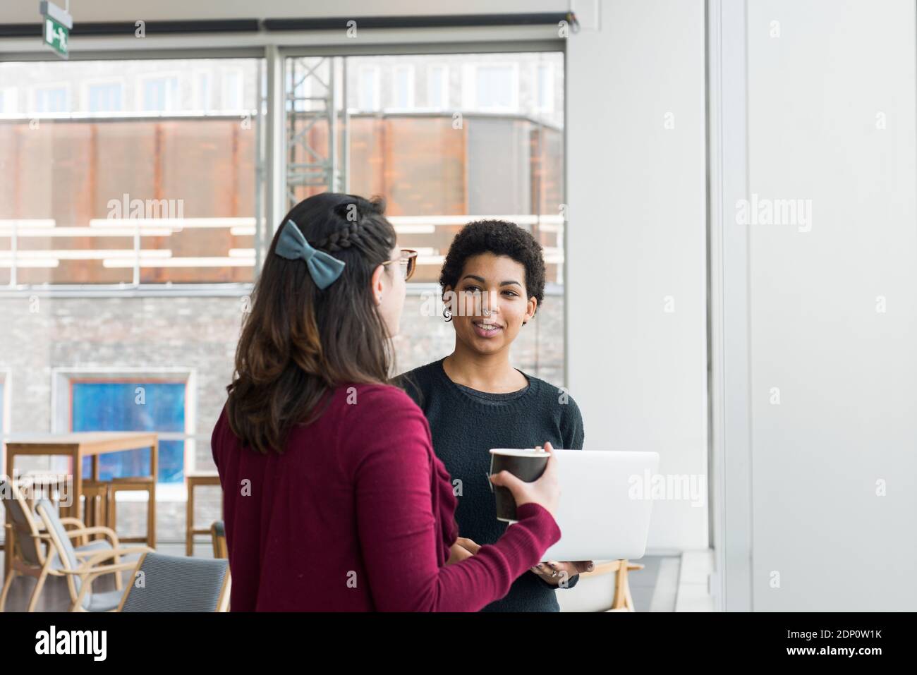Two friends talking school hi-res stock photography and images - Alamy