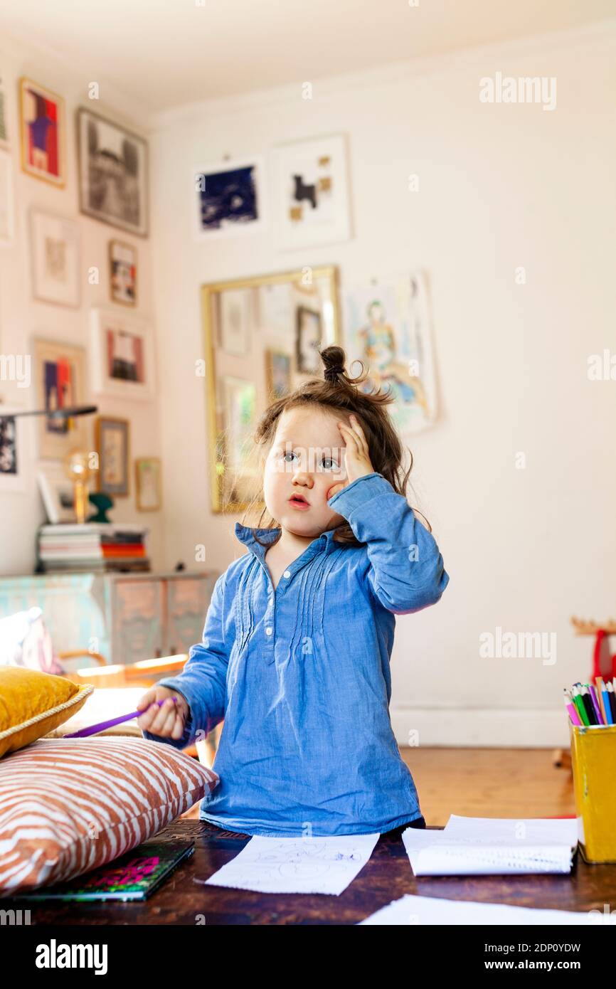 Girl at home looking away Stock Photo