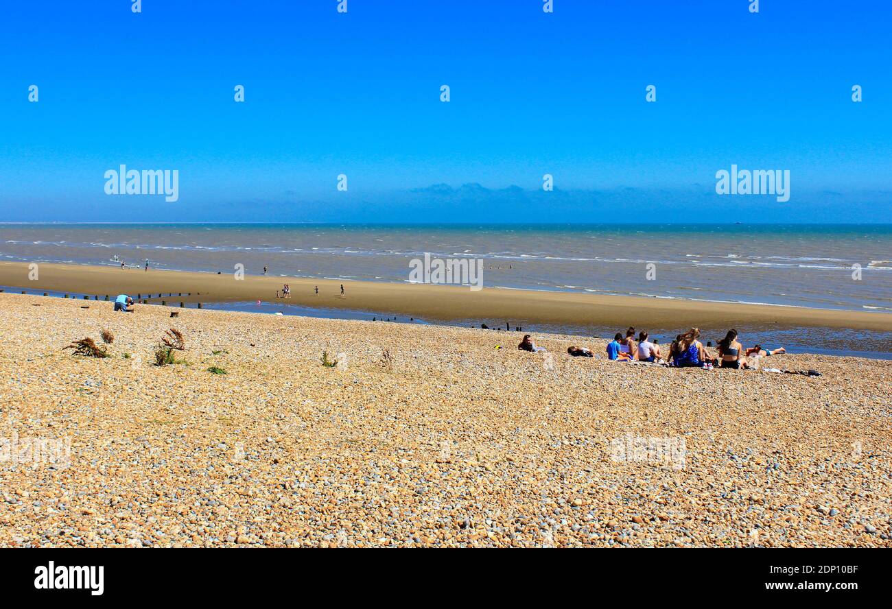 Summer day at Winchelsea Beach at lowtide looking north.The beach