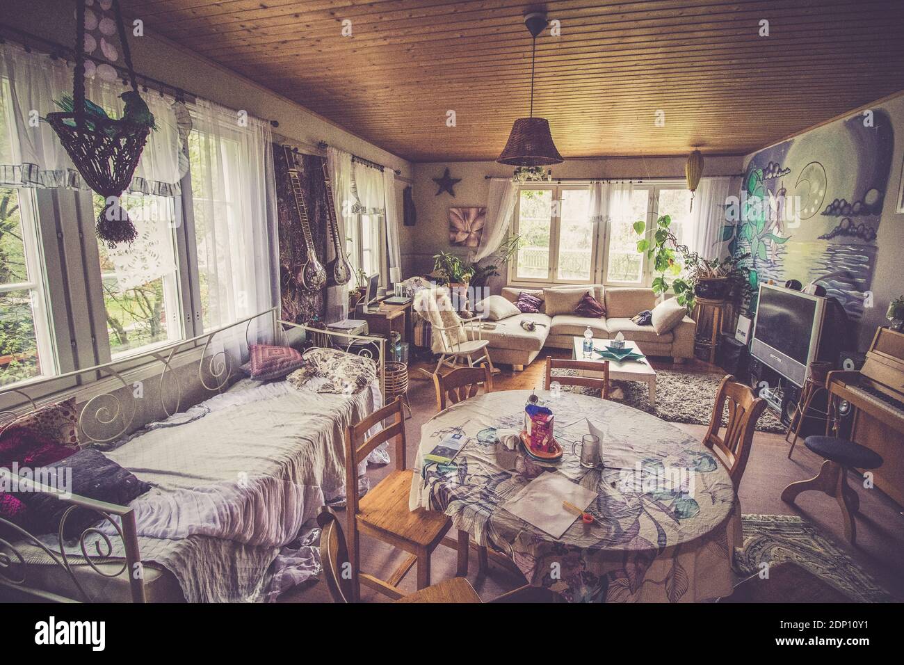 Vintage retro house interior, cosy atmosphere, lot of light, wooden  ceiling. Toned image Stock Photo - Alamy