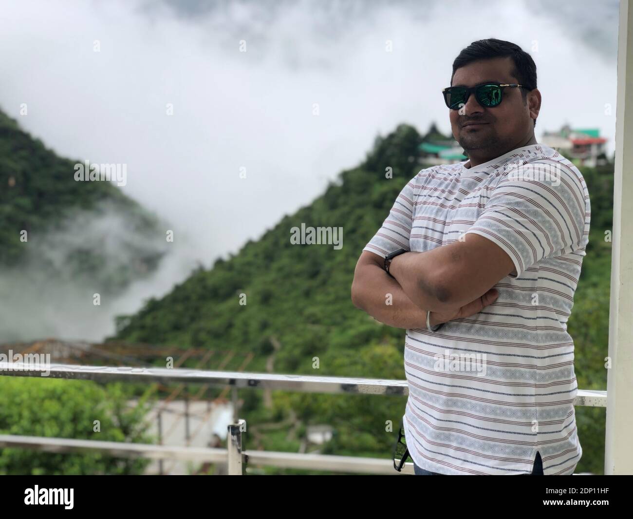 South indian man standing arms hi-res stock photography and images - Alamy
