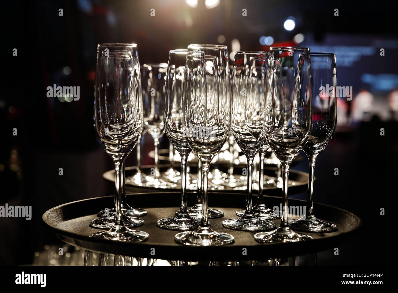 https://c8.alamy.com/comp/2DP14NP/empty-champagne-glasses-on-serving-tray-2DP14NP.jpg