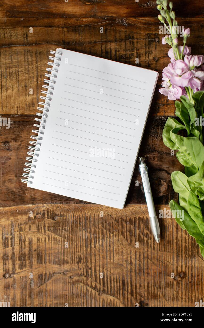 Open notebook on wooden background Stock Photo