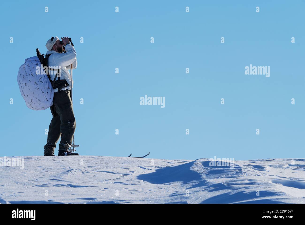 Cross country skier against blue sky Stock Photo