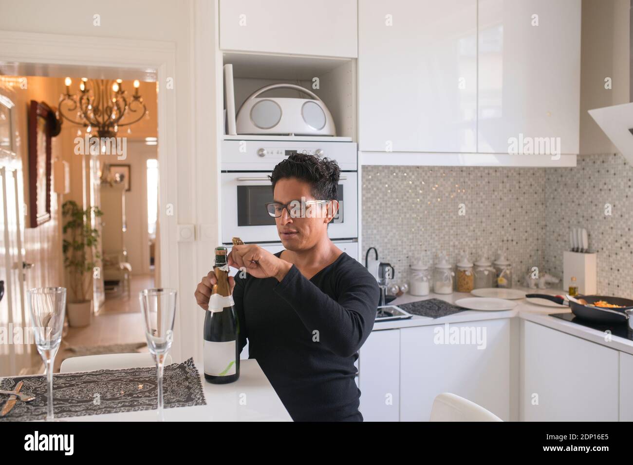 Man opening champagne bottle Stock Photo