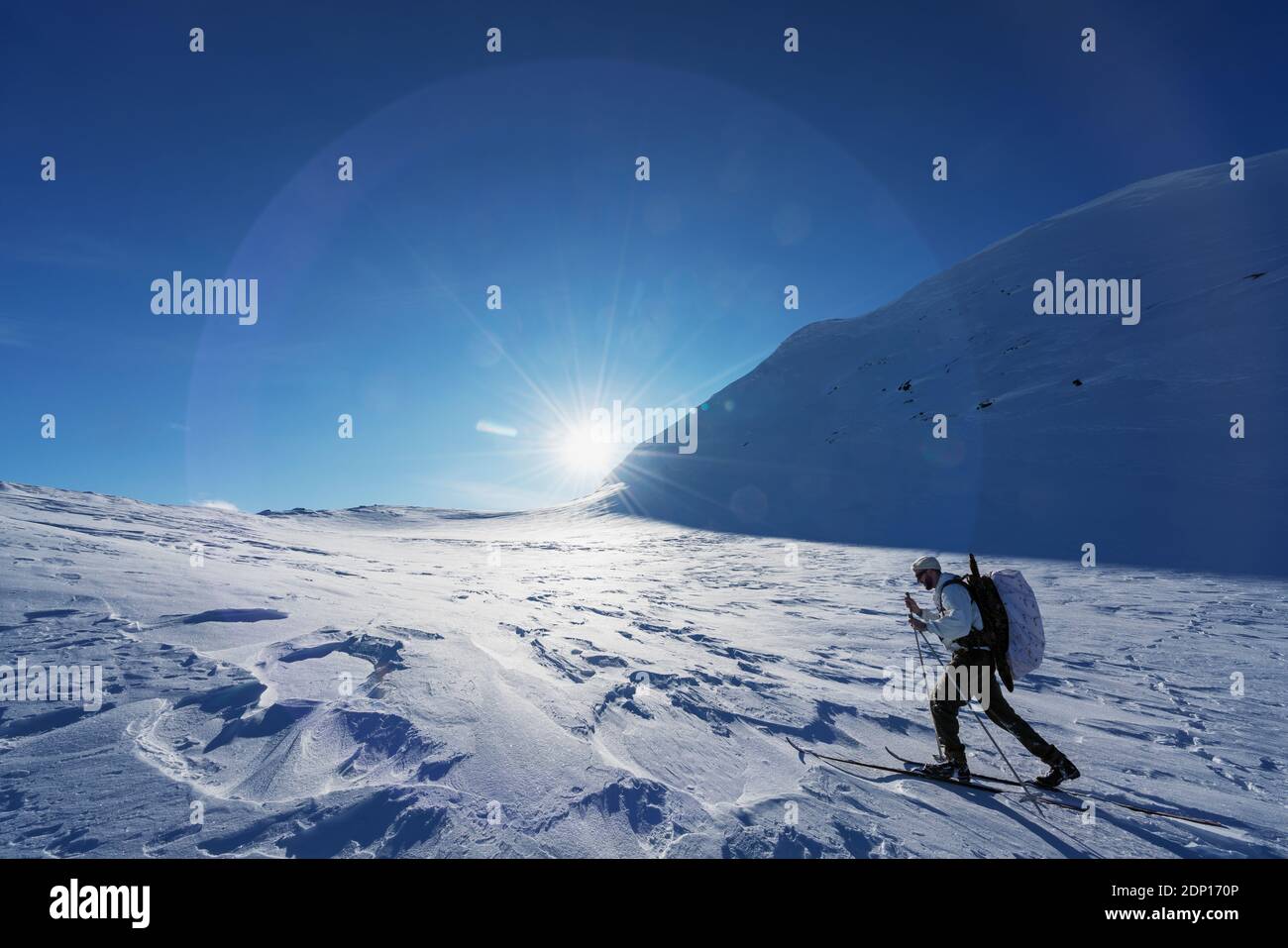 Cross country skier in mountains Stock Photo