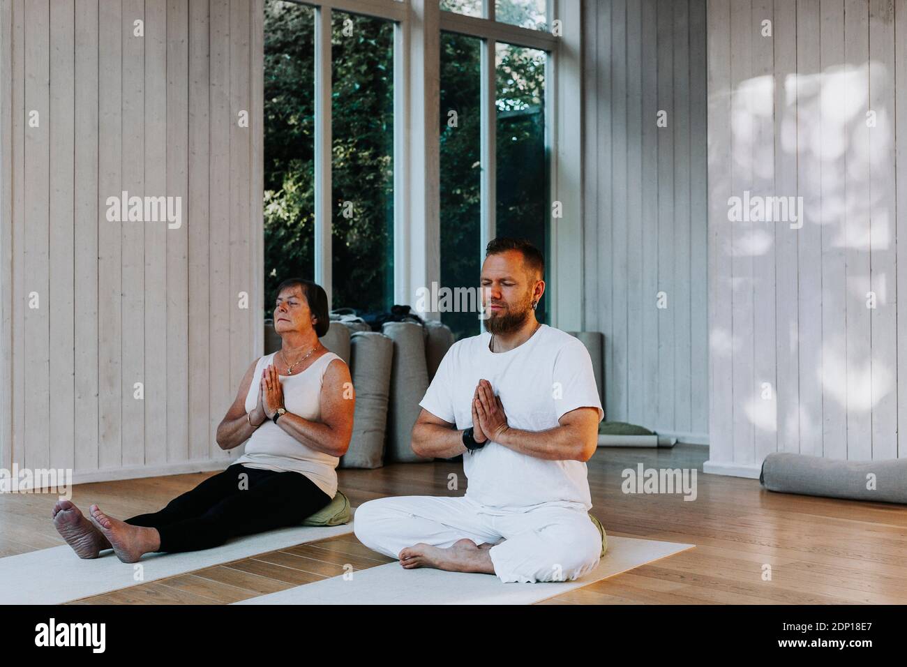 People practicing yoga in class Stock Photo