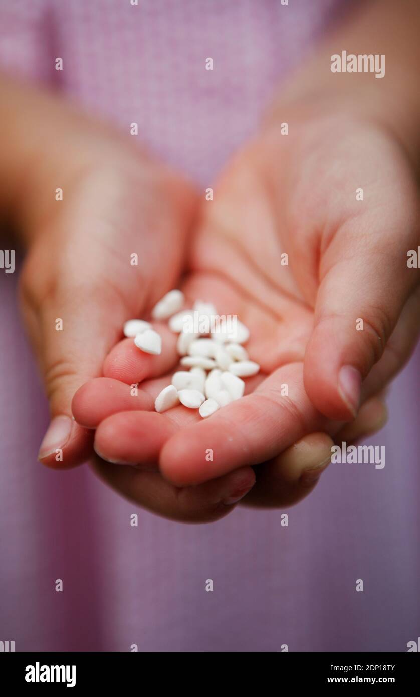 Pills on hands Stock Photo