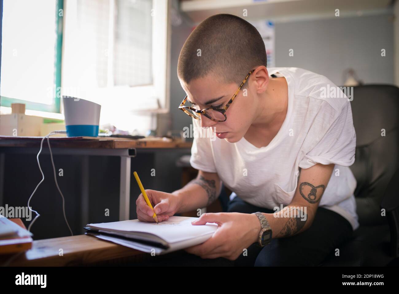 Female designer working in office Stock Photo