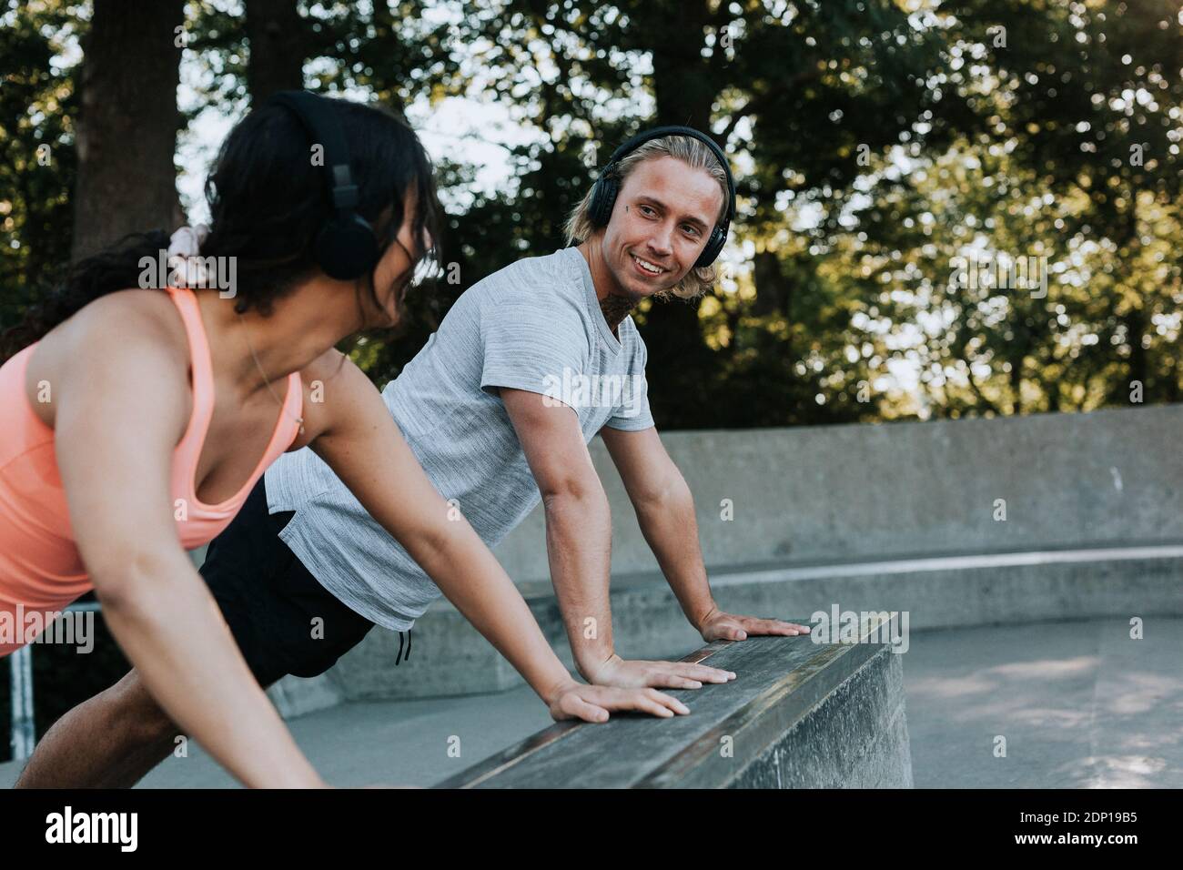 Couple doing push-ups together Stock Photo