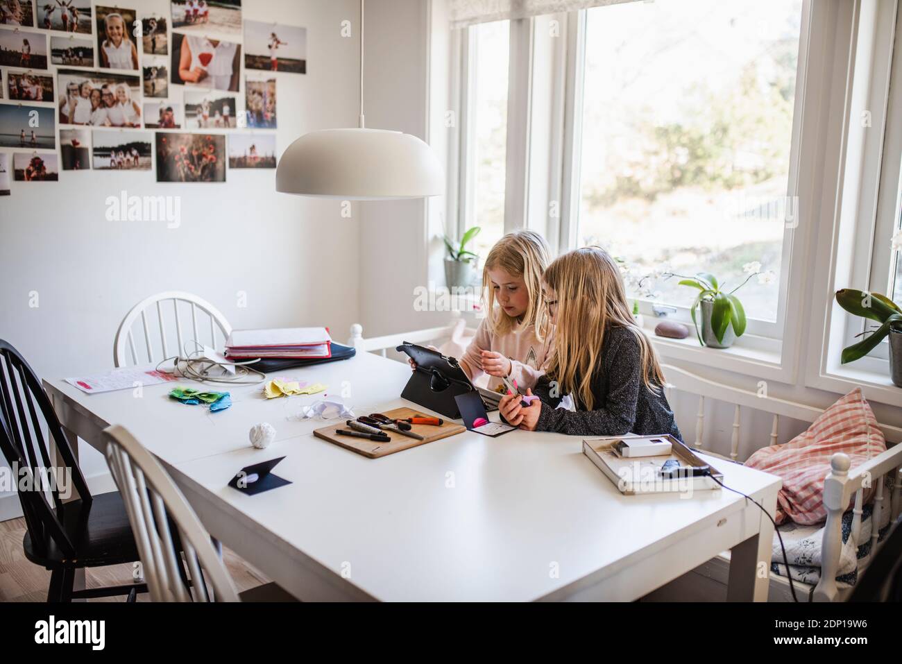 Sisters using digital tablet Stock Photo