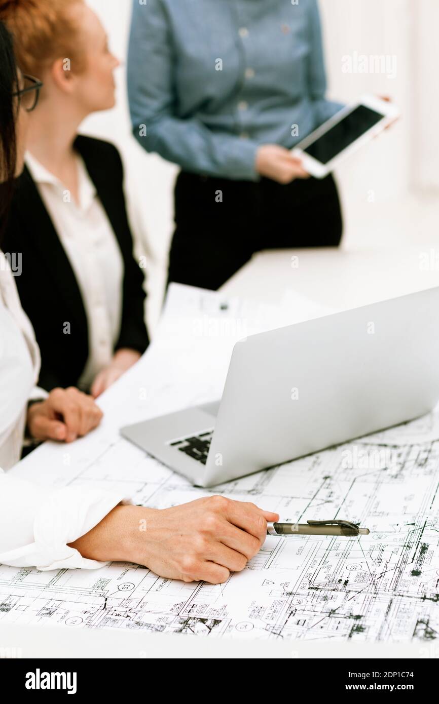 Mid section of businesswomen at meeting Stock Photo