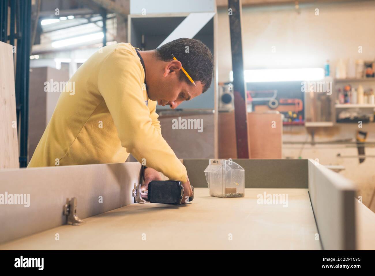 Carpenter working in workshop Stock Photo