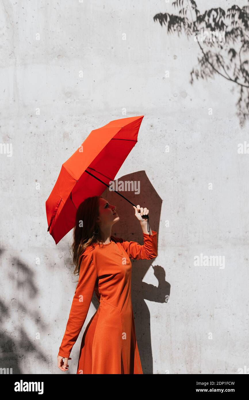Dress red umbrella hi-res stock photography and images - Alamy