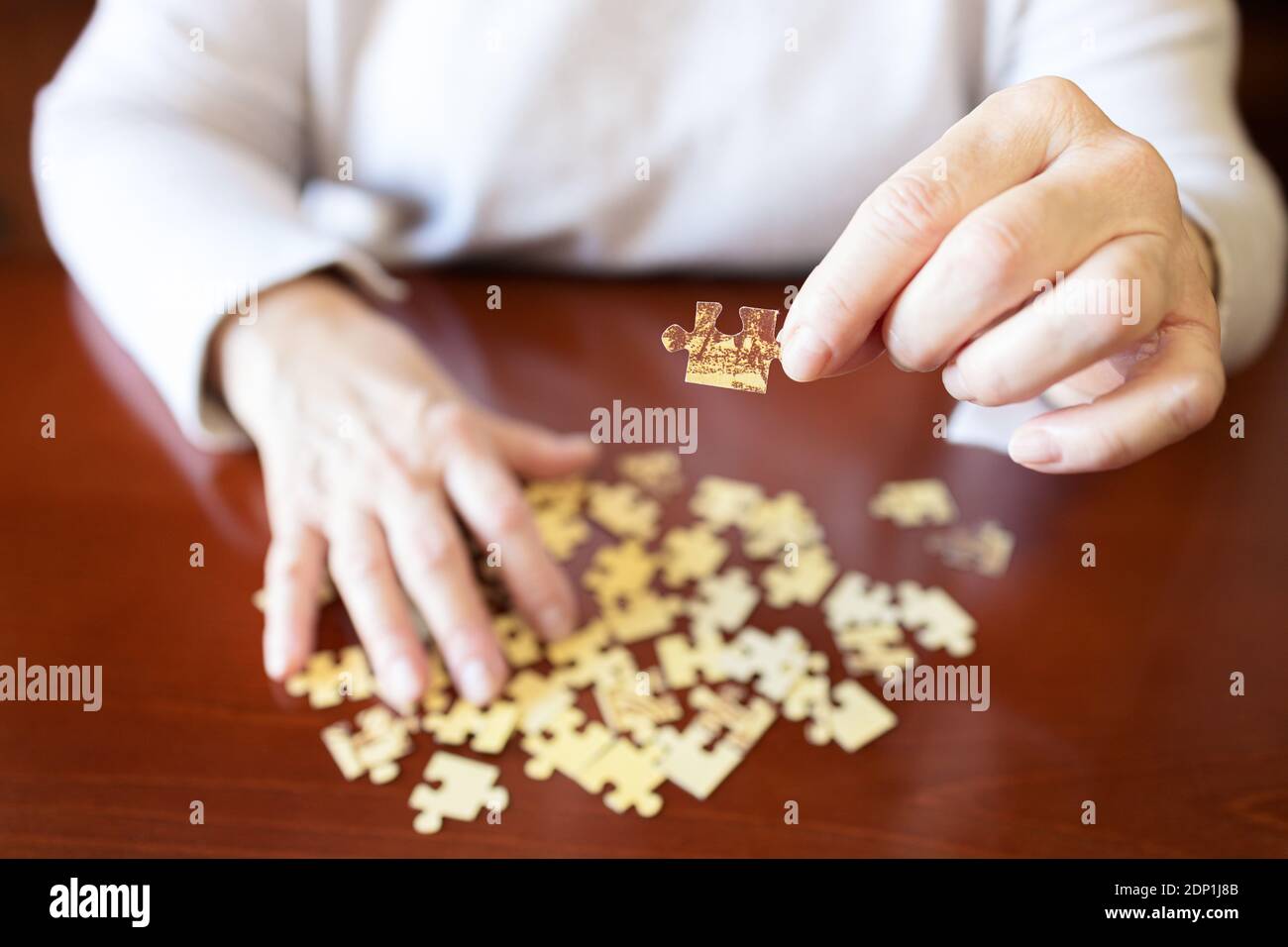 Hands jigsaw puzzle pieces hi-res stock photography and images - Alamy