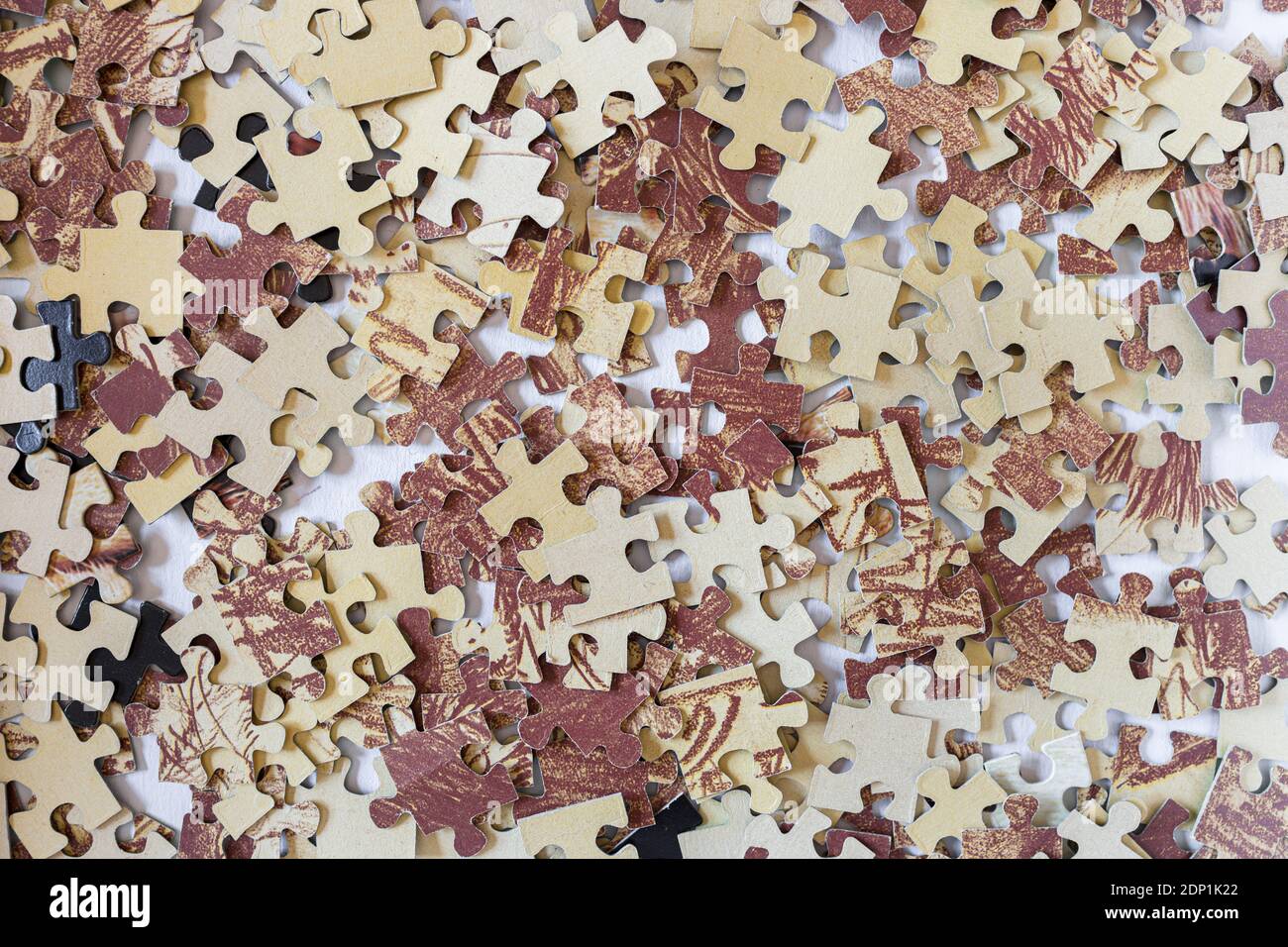 Jigsaw puzzle pieces on a table Stock Photo